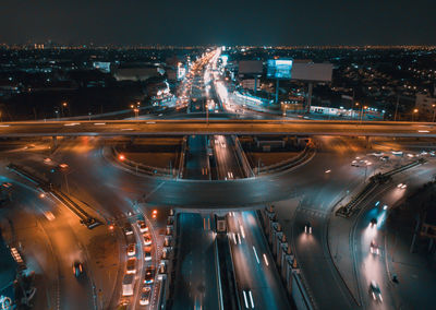 High angle view of light trails on city street at night