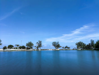 Scenic view of sea against blue sky