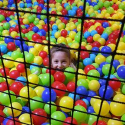 Portrait of smiling boy playing with colorful balloons