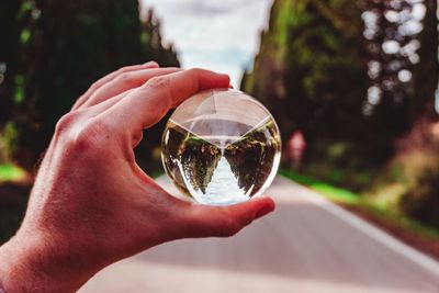 Close-up of person hand holding glass