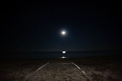 Scenic view of sea against sky at night