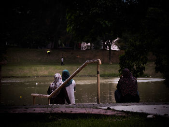 Man working in water at night