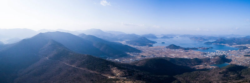 Scenic view of mountains against blue sky