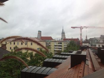 Buildings against cloudy sky