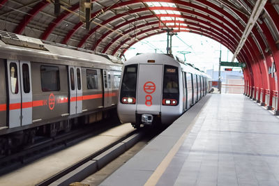 Delhi metro train arriving at jhandewalan metro station in new delhi, india,asia, public metro train