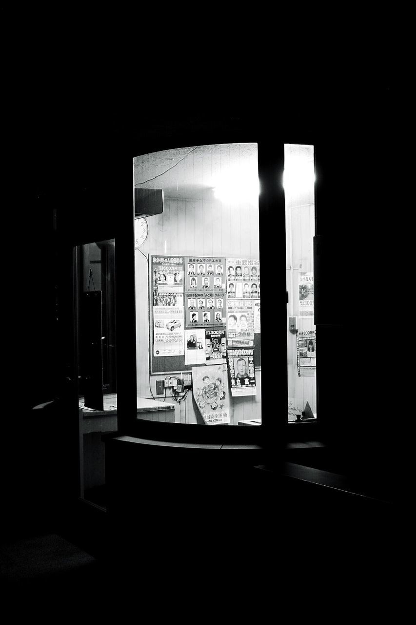 indoors, text, western script, communication, window, built structure, architecture, table, no people, empty, absence, day, open, sunlight, shadow, wall - building feature, glass - material, non-western script, book, wall