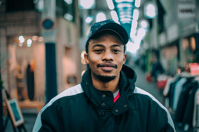 Portrait of young man in city