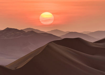 Scenic view of desert against sky during sunset