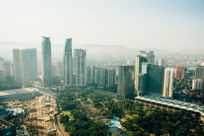 High angle view of buildings in city against sky