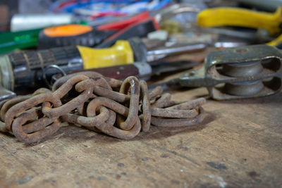 Close-up of rusty metal on table