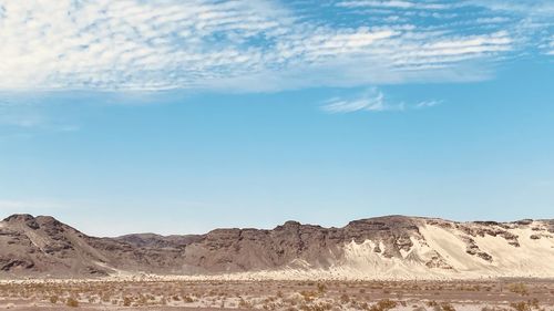 Scenic view of desert against sky