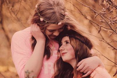 Close-up of lesbian couple at forest