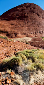 Scenic view of desert land against sky