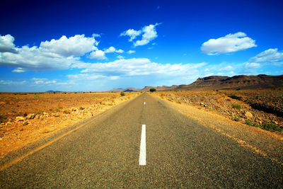 Empty road against sky