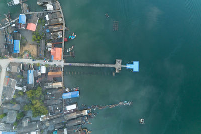 High angle view of buildings by lake