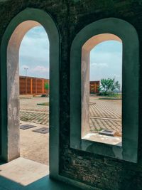 Buildings seen through arch window