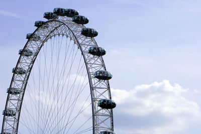 Low angle view of ferris wheel against sky