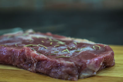 Close-up of meat on cutting board