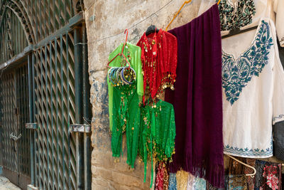 Clothes drying against wall of building