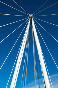 Low angle view of bridge against clear blue sky