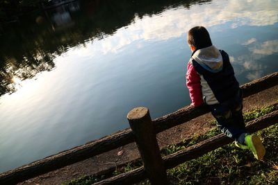 Full length of woman sitting in lake