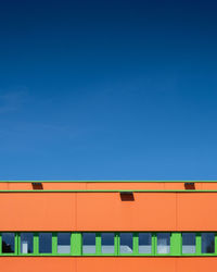 Low angle view of building against clear blue sky