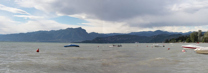 Scenic view of sea against cloudy sky