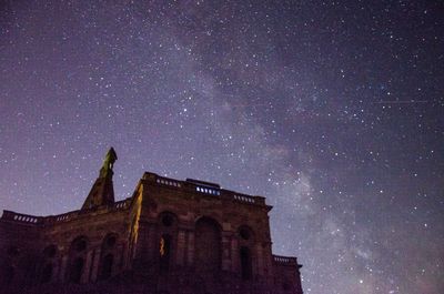 Scenic view of the hercules monument against the night sky with milky way