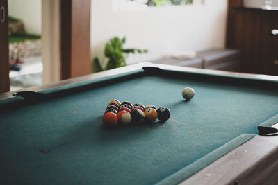 Cropped hand playing pool