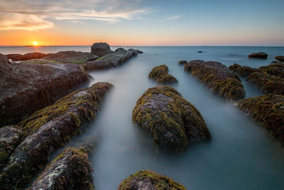 Scenic view of sea against sky during sunset