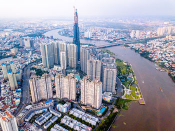 High angle view of modern buildings in city against sky