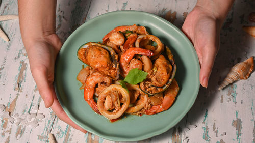 High angle view of person preparing food on table