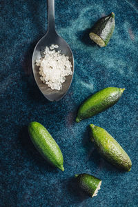 High angle view of green chili peppers