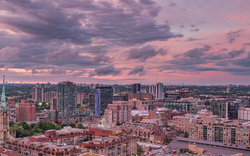 High angle view of buildings against sky during sunset