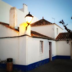 Low angle view of illuminated building against clear sky