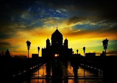 Built structure against sky at sunset