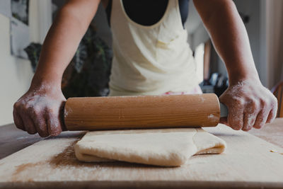 Midsection of man preparing food on table