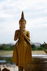 Statue of buddha against sky