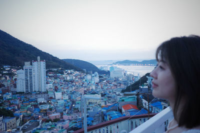 Young woman looking at cityscape