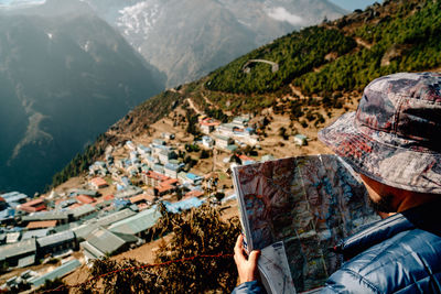 Panoramic view of people looking at mountains