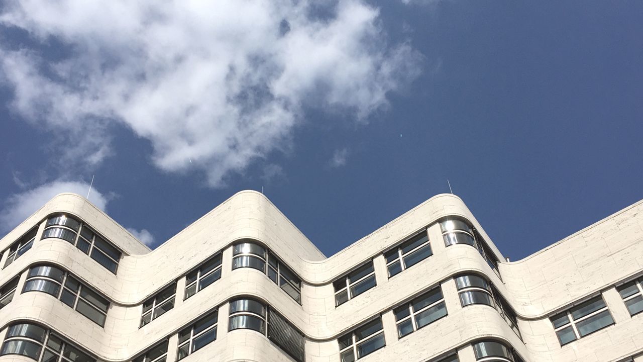 low angle view, architecture, building exterior, no people, sky, built structure, outdoors, cloud - sky, day