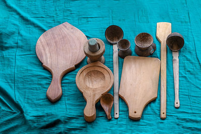 High angle view of wooden spoons on table