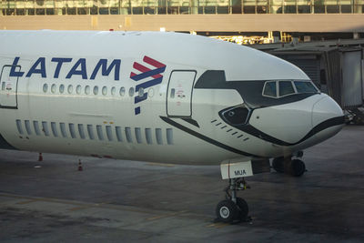 Close-up of airplane on airport runway