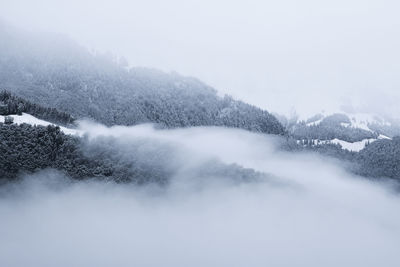 Scenic view of mountains against sky during winter