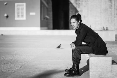 Portrait of teenage girl sitting on seat