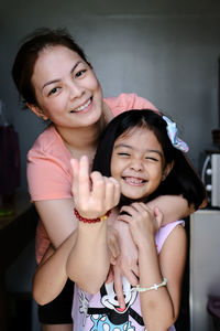 Portrait of happy mother and daughter