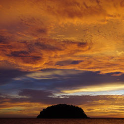 Low angle view of dramatic sky during sunset