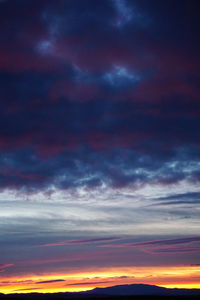Low angle view of dramatic sky during sunset