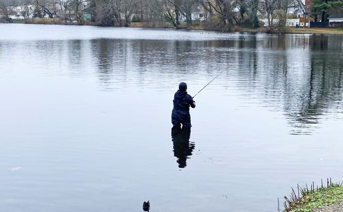 Man fishing in lake