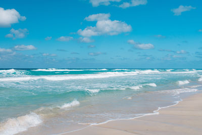 Scenic view of beach against sky